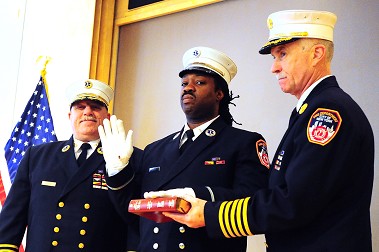 Dwight Scott takes the Oath of Office for his promotion to lieutenant during the ceremony.