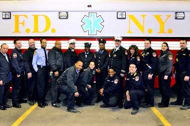 EMTs Shaun Alexander and Khadijah Hall with the members of Station 58 in Brooklyn.