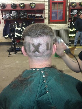 Fire Capt. Brian Ott gets his head shaved