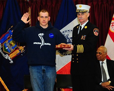 Marcus Musser takes the Oath of Office with Chief of Department Edward Kilduff.
