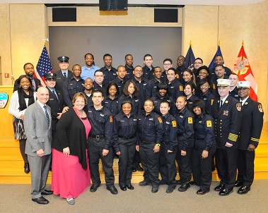 Fire Commissioner Salvatore Cassano, Chief of Department Edward Kilduff and Assistant Commissioner for Recruitment and Diversity Michele Maglione join the new EMTs.