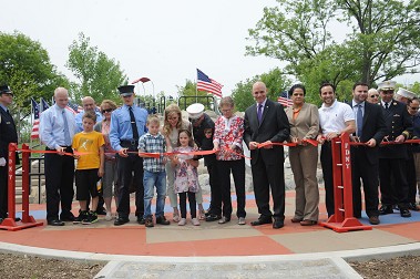 A ribbon is cut officially rededicating the Lt. John Martinson Park on Staten Island.