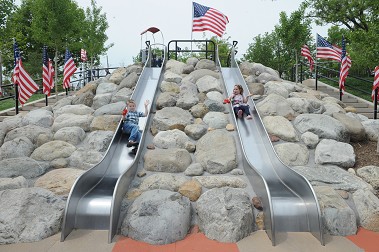 Children play at the newly re-opened park.