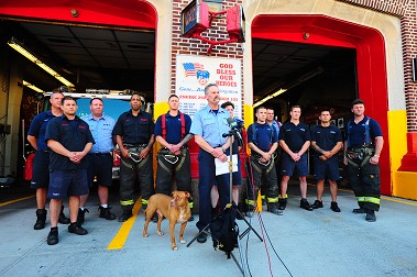 Capt. Daniel Florenco speaks about the rescue alongside the firefighters from Engine 290/Ladder 103