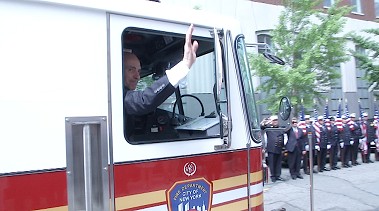 Fire Commissioner Salvatore Cassano rides away from Headquarters aboard Engine 31, where he once worked.