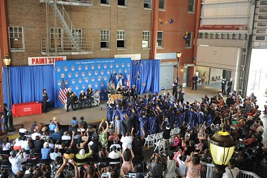 The class of 2014 toss their caps in the air to celebrate their graduation.