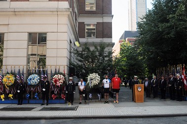 Along the route, the group stopped to lay wreaths at the 9/11 memorial outside FDNY Headquarters.