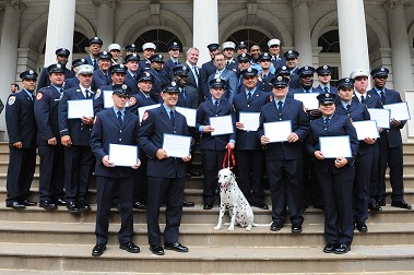 Mayor Bill de Blasio and Fire Commissioner Daniel Nigro with the men and women who helped rescued the three children on July 29.