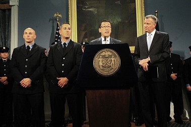 Fire Commissioner Daniel Nigro praises the men and women who worked at the Brooklyn fire, including FF Justin Tallett (far left) and FF Frank Blackstone (second from left), before each member of the group was presented with certificates from the Mayor.