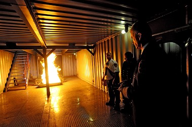 Senior staff, including the Fire Commissioner Daniel Nigro, First Deputy Commissioner Robert Turner and Chief of Department Edward Kilduff (pictured), view the engine room fire simulator aboard the new Shipboard Simulator.