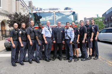 Firefighters from Engine 80/Ladder 23 (L to R) FF Daniel Bozek, FF Matthew Chase, FF Craig Roloson, FF Kamar Malone, Lt. Edward Reardon, Capt. Matthew Hagan, Lt. Joseph Canale, FF Mark Johnson, FF Brian Murphy, FF Thomas Long, and FF Brian Johnson.