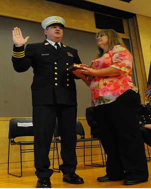 Chief Leonard takes the Oath of Office, as his wife, Patricia, holds the Bible