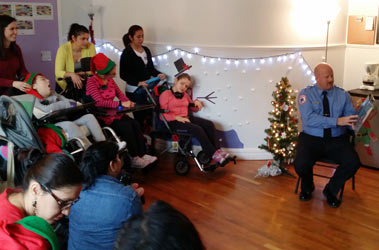 Capt. James Darnowski read 'The Night Before Christmas' to the children.