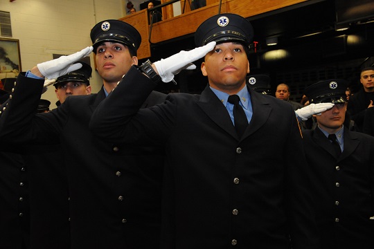 The new graduates salute