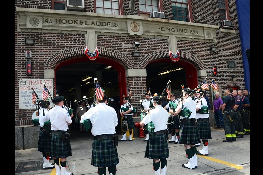 FDNY Emerald Society Pipes and Drums perform during the centennial ceremony