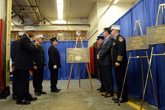 FDNY Chaplain Reverend V. Simpson Turner blesses the firehouse centennial plaque