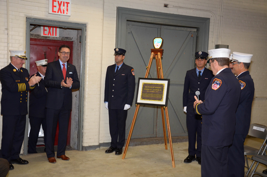 (from left) Chief of Department James E. Leonard, FDNY Commissioner Daniel A. Nigro and members of Engine Company 160 unveil the centennial plaque.