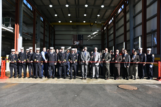 Commissioner Daniel Nigro, Chief of Department James Leonard, and Chief of Marine Operations Michael Buckheit are joined by FDNY Members in cutting the ribbon to the new Marine Vessel Maintenance building.