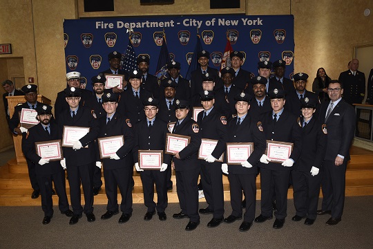 The graduating class of Fire Protection Inspectors are awarded their diplomas by Commissioner Nigro and Chief Leonard