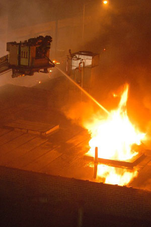 Firefighters battled a four-alarm fire in a one-story 25x100 brick commercial in East Williamsburg, Brooklyn. The building housed a kosher cold storage and ice cream packing facility. Thirty three units responded to the early morning fire that was brought under control in less than six hours. One firefighter was treated for minor injuries. The cause of the fire is under investigation. Photo by Firefighter Michael Gomez, Squad 288.