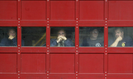 Firefighters, neighbors and friends mourn the loss of Firefighters Joseph Graffagnino and Robert Beddia at Engine Company 24/Ladder Company 5. The firefighters lost their lives in a seven-alarm fire on August 18. Photo courtesy of G.N.Miller/NY Post