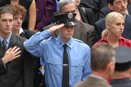  Firefighter Daniel Pujdak's (L-146) brother Matthew salutes during the 100th Annual FDNY Memorial Day ceremony. Matthew Pujdak is currently enrolled in the FDNY Academy