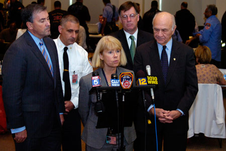 Photo of FDNY's Chief Medical Officer Kerry Kelly (center) and Fire Commissioner Nicholas Scoppetta (far right) discuss BIOPOD 2007 during a press conference at Fire Department Headquarters POD site on November 9. (L to R) New York State Deputy Secretary for Public Safety Michael Balboni, acting FDNY Counterterrorism and Emergency Preparedness Chief Michael Puzziferri and First Deputy Commissioner Frank Cruthers.