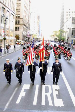 FDNY marchers make their way up Fifth Avenue during the Veteran's Day Parade.