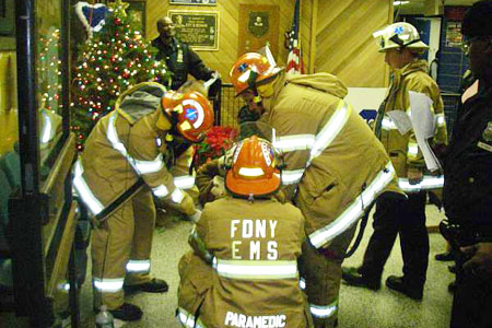 EMS members treat one of the 15 victims of a two bus accident in Brooklyn.
