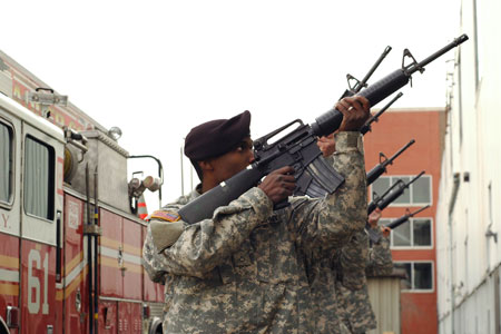 Members of the 69th Infantry (the Fighting 69th) give a 21-gun salute during the FDNY's ceremony honoring its veterans on January 19.