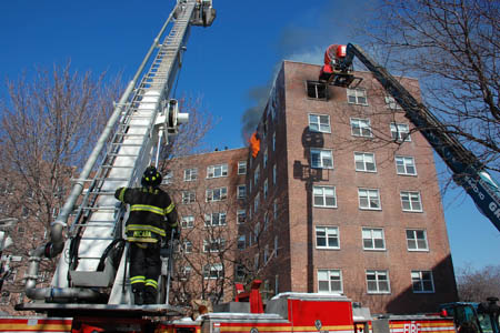 Officials study the science of wind-driven high-rise fires during experiments using a wind machine that forces 20 MPH winds into an apartment of an abandoned building.
