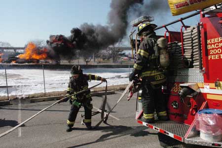 A 9,000-gallon gas truck overturned and burst into flames at around 1215 hours. Approximately 280 firefighters used a special alcohol-based foam to douse the flames. The fire was deemed under control in approximately two hours. The driver of the tanker was killed by the extreme conditions.