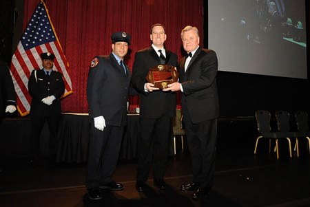 Principal James Anderson (center) accepted the Commissioner Thomas Von Essen Fire Safety Education Award on behalf of the FDNY High School for Fire and Life Safety.