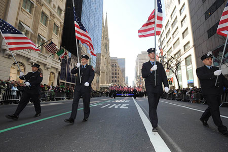 Four flags are carried up Fifth Avenue in rememberance of the four members who died in the line of duty in the last year - Lieutenants John Martinson and Joseph Graffagnino and Firefighters Daniel Pujdak and Robert Beddia. The flags were carried by firefighters from each of the men's companies.