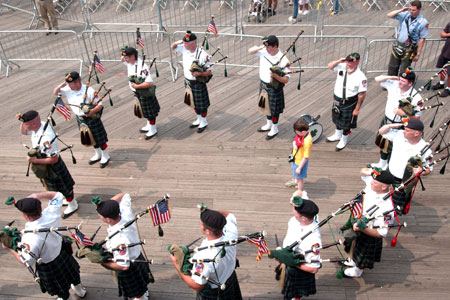 The Emerald Society Pipes and Drums Band plays as the FDNY chaplains bless the Marine Fleet during the 7th Annual Blessing of the Fleet ceremony in Manhattan.