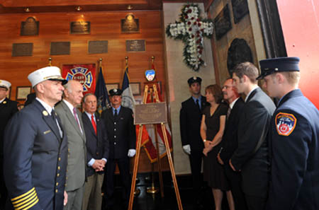 Mayor Michael Bloomberg, Fire Commissioner Nicholas Scoppetta and Chief of Department Salvatore Cassano join the Pujdak family - including his parents, Leo and Christina, and brothers, Matthew and David - as a plaque is unveiled in the Firefighter Daniel Pujdak's honor at the quarters of Engine 229/Ladder 146 in Brooklyn.