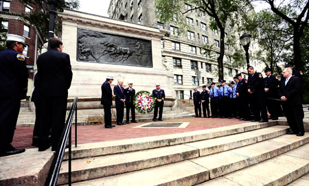 Fire Commissioner Nicholas Scoppetta, Chief of Department Salvatore Cassano, Chief of Operations Patrick McNally and FDNY Chaplain Reverend Stephen Harding place a wreath at the Firefighters' Memorial in upper Manhattan on the morning of Sept. 11.