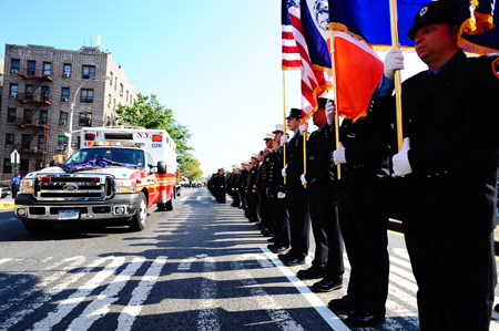 FDNY EMT Jason Ruiz's ambulance was draped with purple and black bunting to honor the hero at his funeral on Sept. 18.