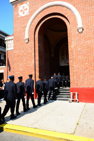 FDNY EMS members file into St. Michael's Roman Catholic Church in Brooklyn.