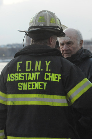 Fire Commissioner Nicholas Scoppetta is briefed by Assistant Chief of Operations Robert Sweeney.