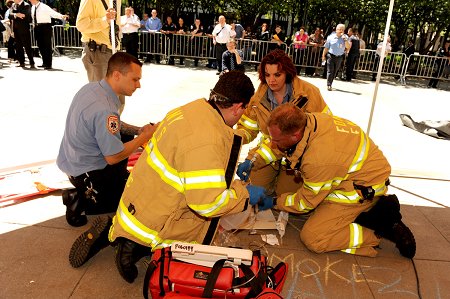 Members of the first place ALS team intubate a simulated victim.