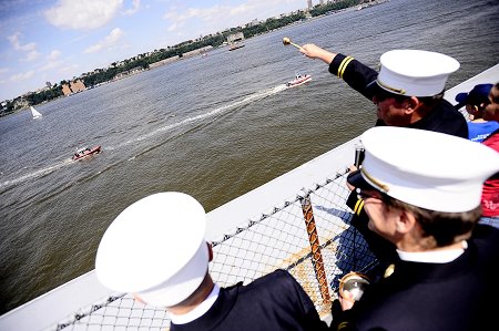 FDNY Chaplains Monsignor John Delendick and Reverend Stephen Harding bless the FDNY's Marine Fleet from atop the flight deck of the USS Intrepid.