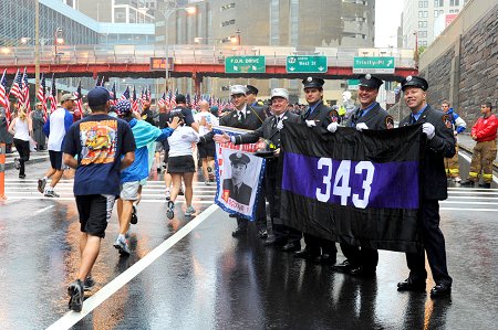 Firefighter volunteers cheered for runners throughout the run's 3.1 miles.
