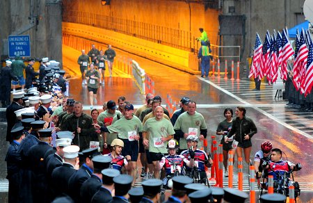 Chief of Department Salvatore Cassano (runner number 4587) finishes the Tunnel to Towers race with Wounded Warriors.