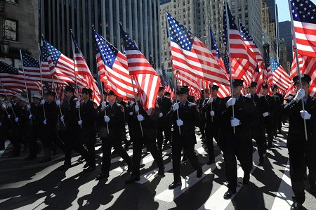 FDNY members carry 343 flags -- representing the members who perished on Sept. 11, 2001 -- up Fifth Avenue.