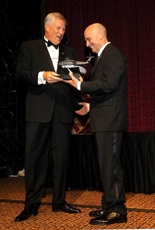 Fire Commissioner Salvatore Cassano presents the Humanitarian Award to Louis Ch�nevert, Chairman and CEO of United Technologies Corporation.