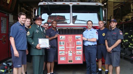 Firefighters at Engine 34/Ladder 21 with Sgt. Carlos Alvelo. (L to R) FF Bill MacSweeney, FF John Mola, Sgt. Alvelo, FF Pat Cullen, FF Franklin Uceta, Lt. Peter Wasserman, FF Chris Gonzalez and FF Andre Zulkifli.