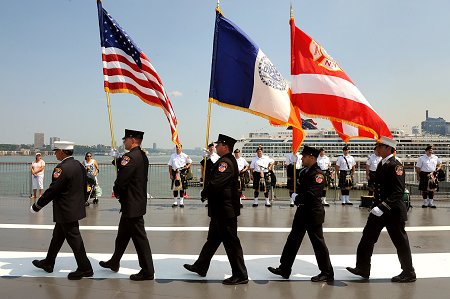 The Honor Guard files in during the Blessing of the Fleet
