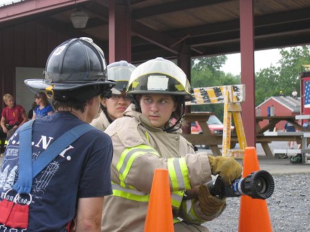 FDNY Lt. Michele Fitzsimmons teaches campers about water supression.