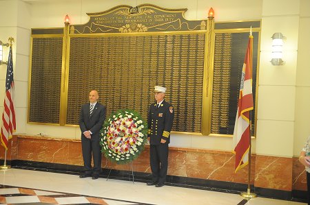 Fire Commissioner Salvatore Cassano (left) and Chief of Department Edward Kilduff lay a wreath at the FDNY Headquarters memorial wall on Sept. 10. The wall lists the names of all FDNY members who have died in the line of duty since the Department was established in 1865.